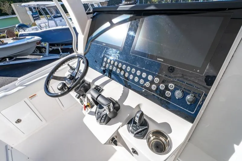  Yacht Photos Pics Edgewater 370CC 2025 boat dashboard with modern controls and dual screens.