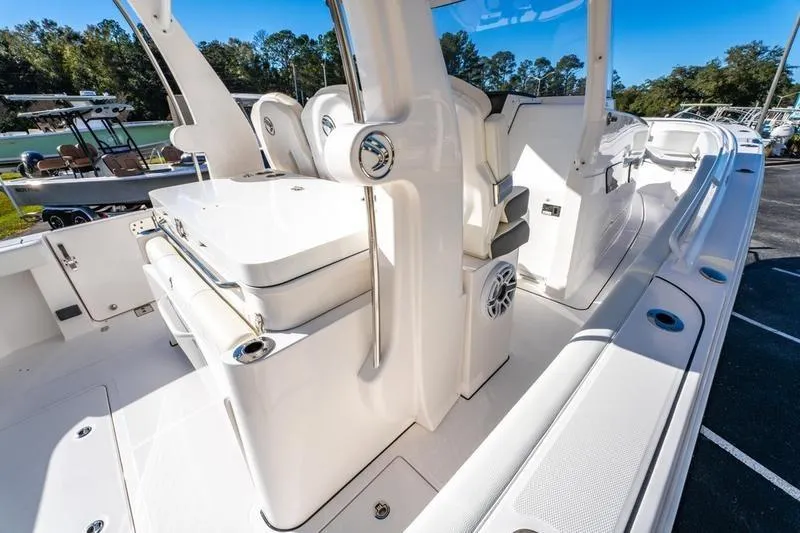  Yacht Photos Pics 2025 Edgewater 370CC boat interior with seating and storage, showcasing sleek design and functionality.