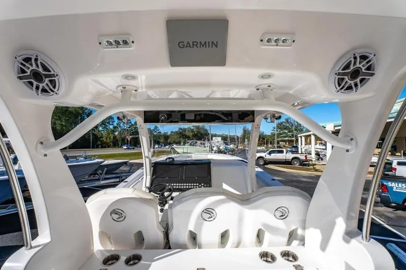 Yacht Photos Pics 2025 Edgewater 370CC boat interior with Garmin electronics and seating, showcasing modern design.
