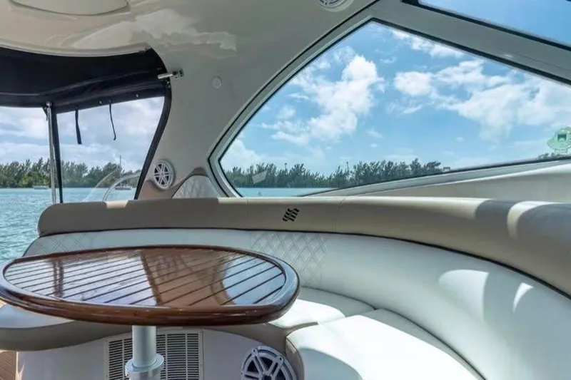  Yacht Photos Pics Luxurious interior of 2009 Four Winns V458 yacht with elegant seating and wooden table.