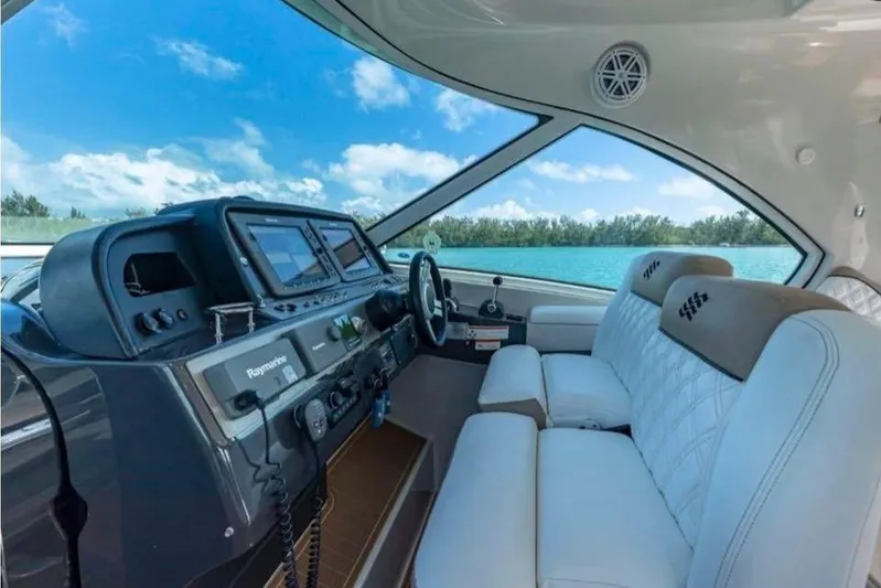  Yacht Photos Pics 2009 Four Winns V458 yacht interior with modern dashboard and luxurious seating.