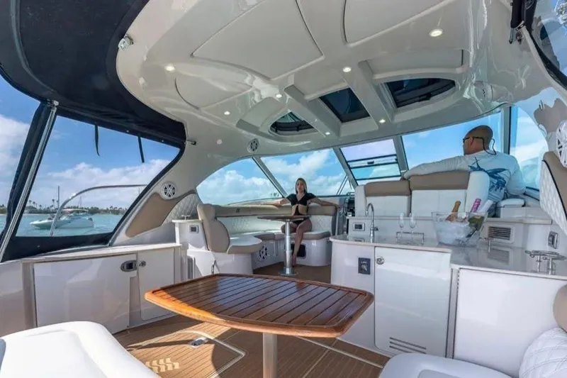  Yacht Photos Pics Luxurious 2009 Four Winns V458 yacht interior with seating, table, and ocean view.