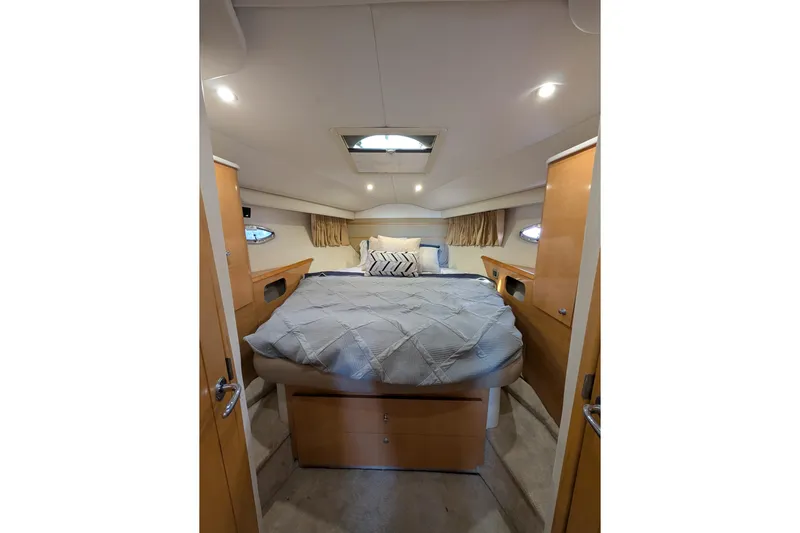  Yacht Photos Pics Luxurious cabin interior of 2009 Four Winns V458 yacht with cozy bed and modern design.