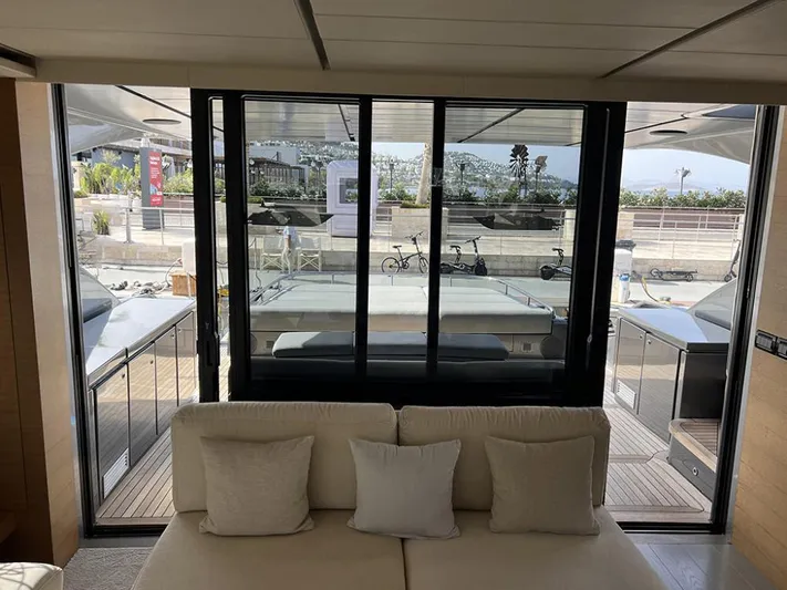  Yacht Photos Pics Interior view of 2012 Pershing 92 yacht, featuring a cozy seating area and large windows.