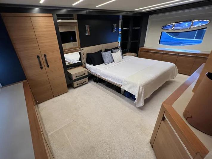  Yacht Photos Pics Luxurious bedroom interior of 2012 Pershing 92 yacht with modern design and elegant furnishings.