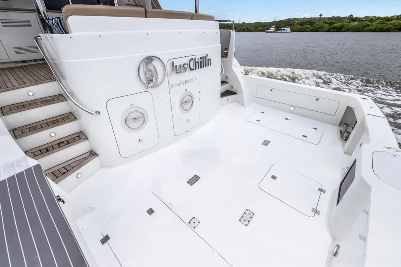 Jus Chill'n Yacht Photos Pics 2012 Cheoy Lee 84 Bravo yacht deck with seating and water view.