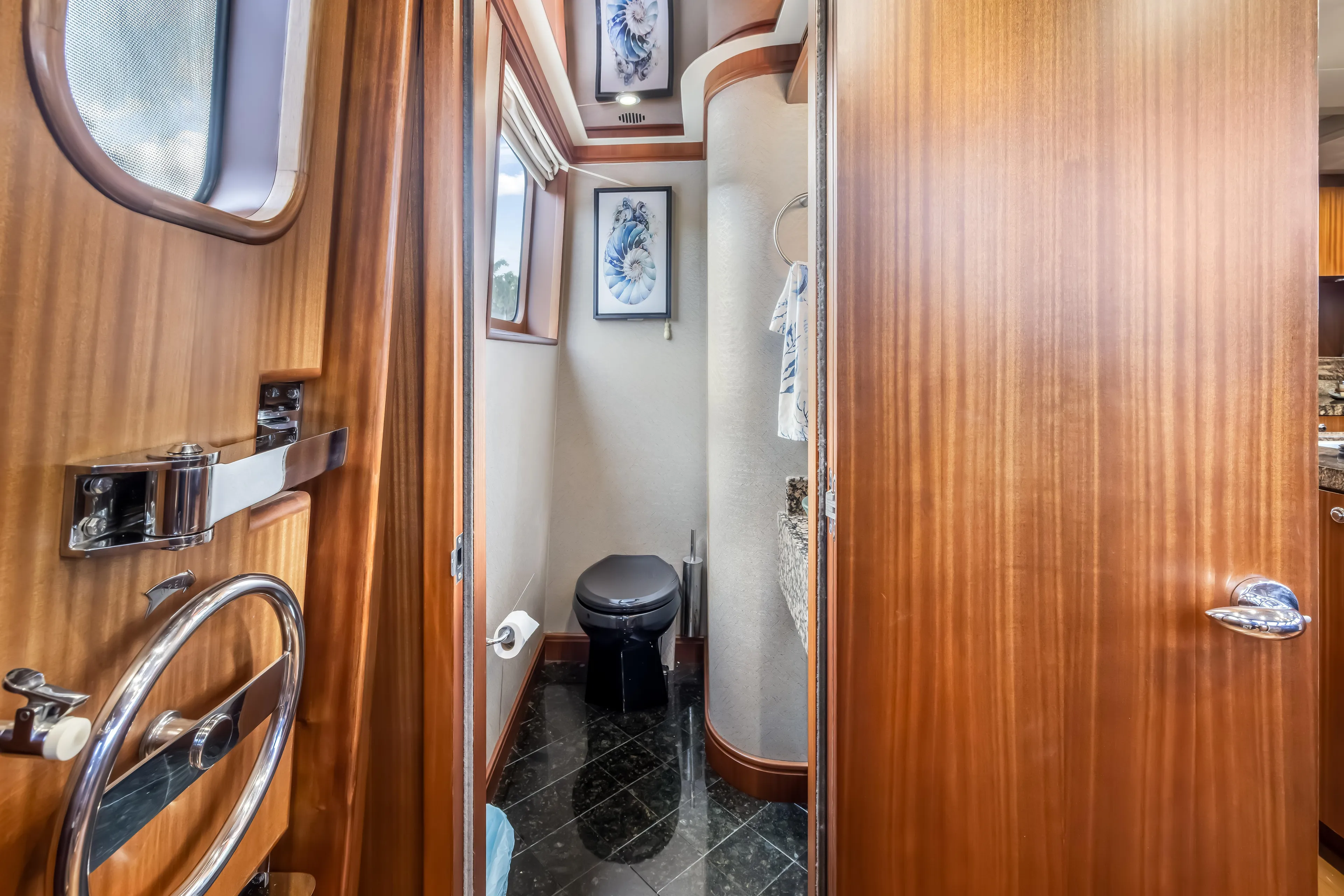 Jus Chill'n Yacht Photos Pics Luxurious 2012 Cheoy Lee 84 Bravo yacht bathroom with elegant wood finish and modern fixtures.