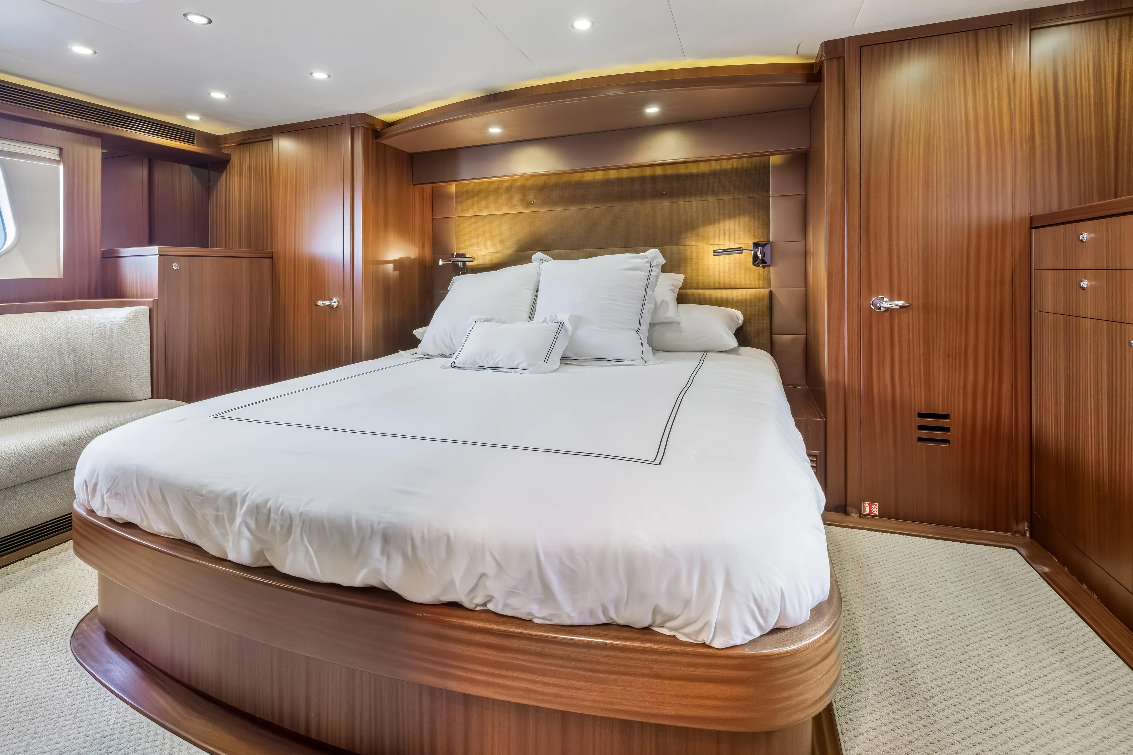Jus Chill'n Yacht Photos Pics Luxurious bedroom interior of 2012 Cheoy Lee 84 Bravo yacht with elegant wood paneling.