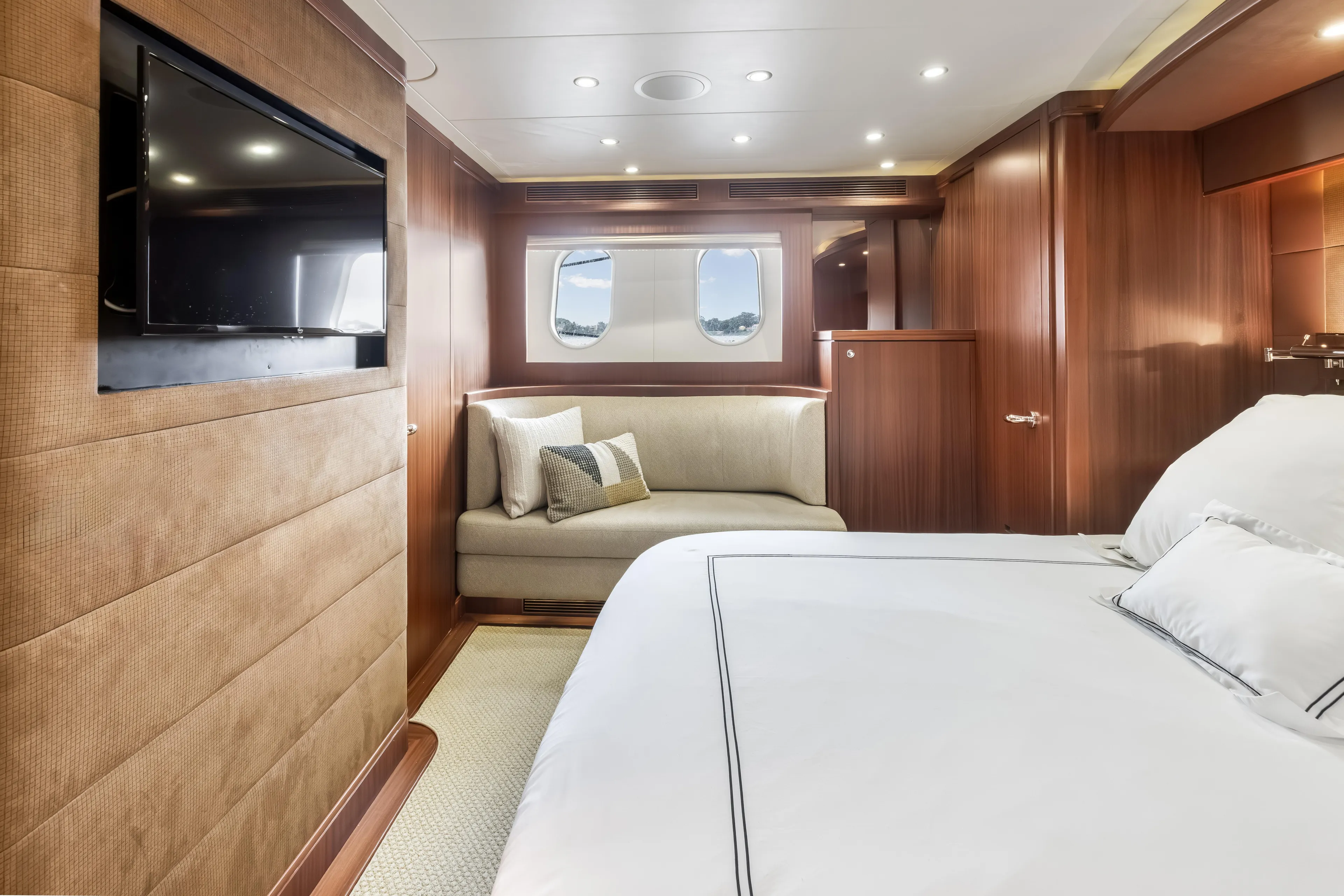 Jus Chill'n Yacht Photos Pics Luxurious interior of 2012 Cheoy Lee 84 Bravo yacht with elegant wood paneling and cozy seating.
