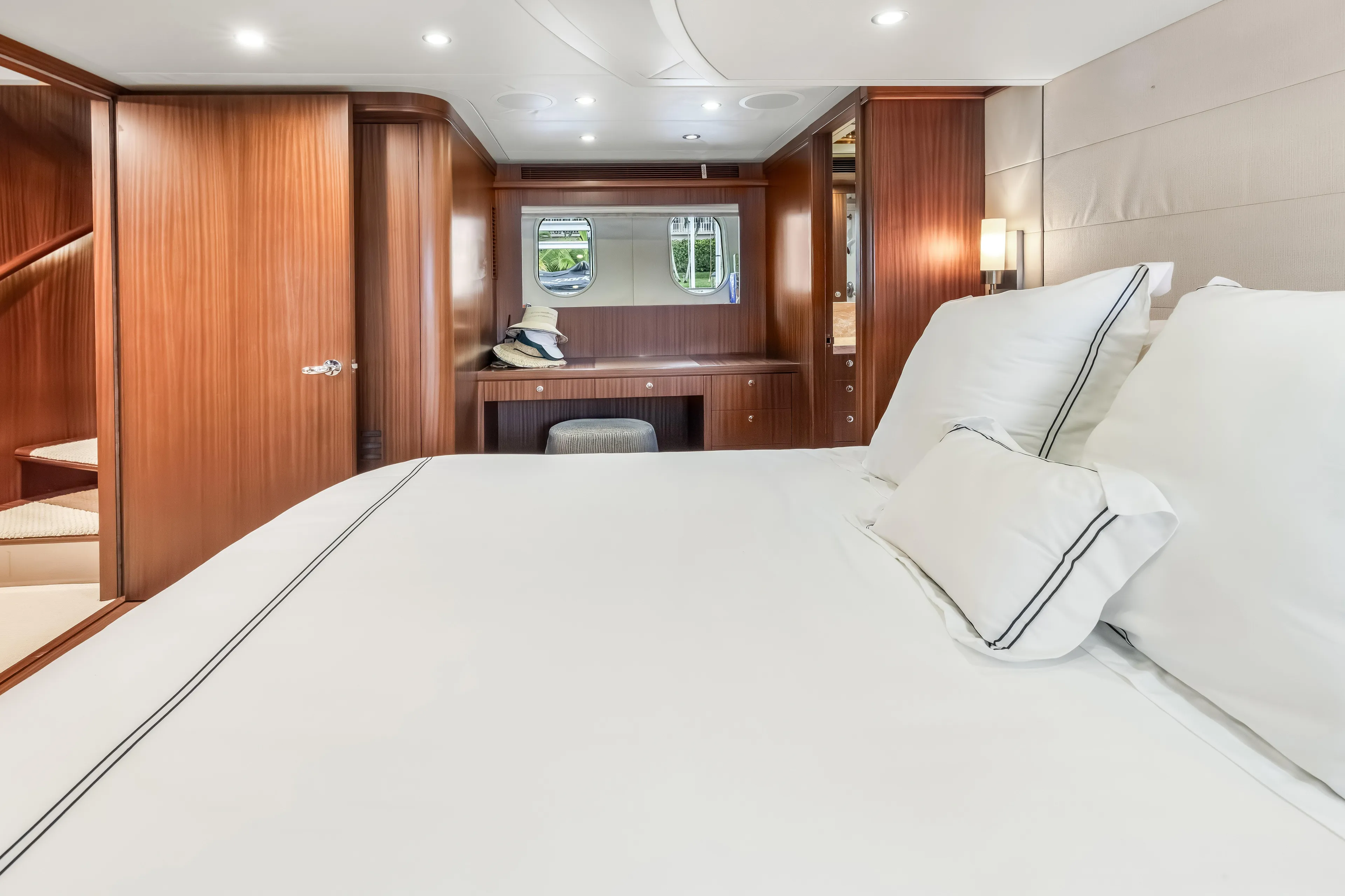 Jus Chill'n Yacht Photos Pics Luxurious bedroom interior of 2012 Cheoy Lee 84 Bravo yacht with elegant wood finishes.