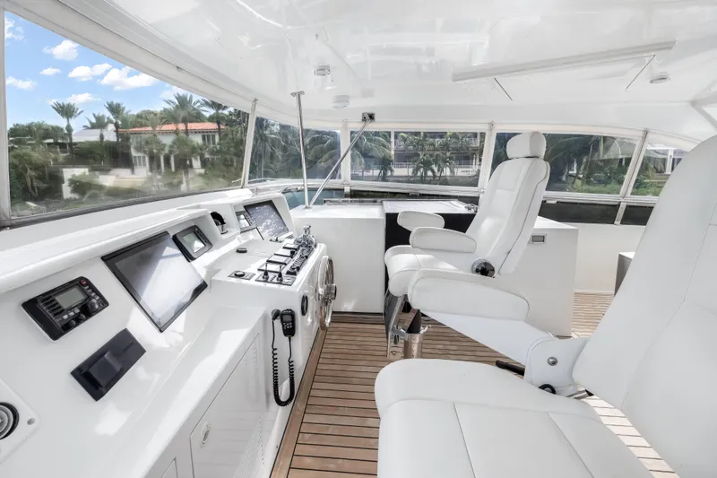 Jus Chill'n Yacht Photos Pics Luxurious helm of 2012 Cheoy Lee 84 Bravo yacht with modern controls and seating.