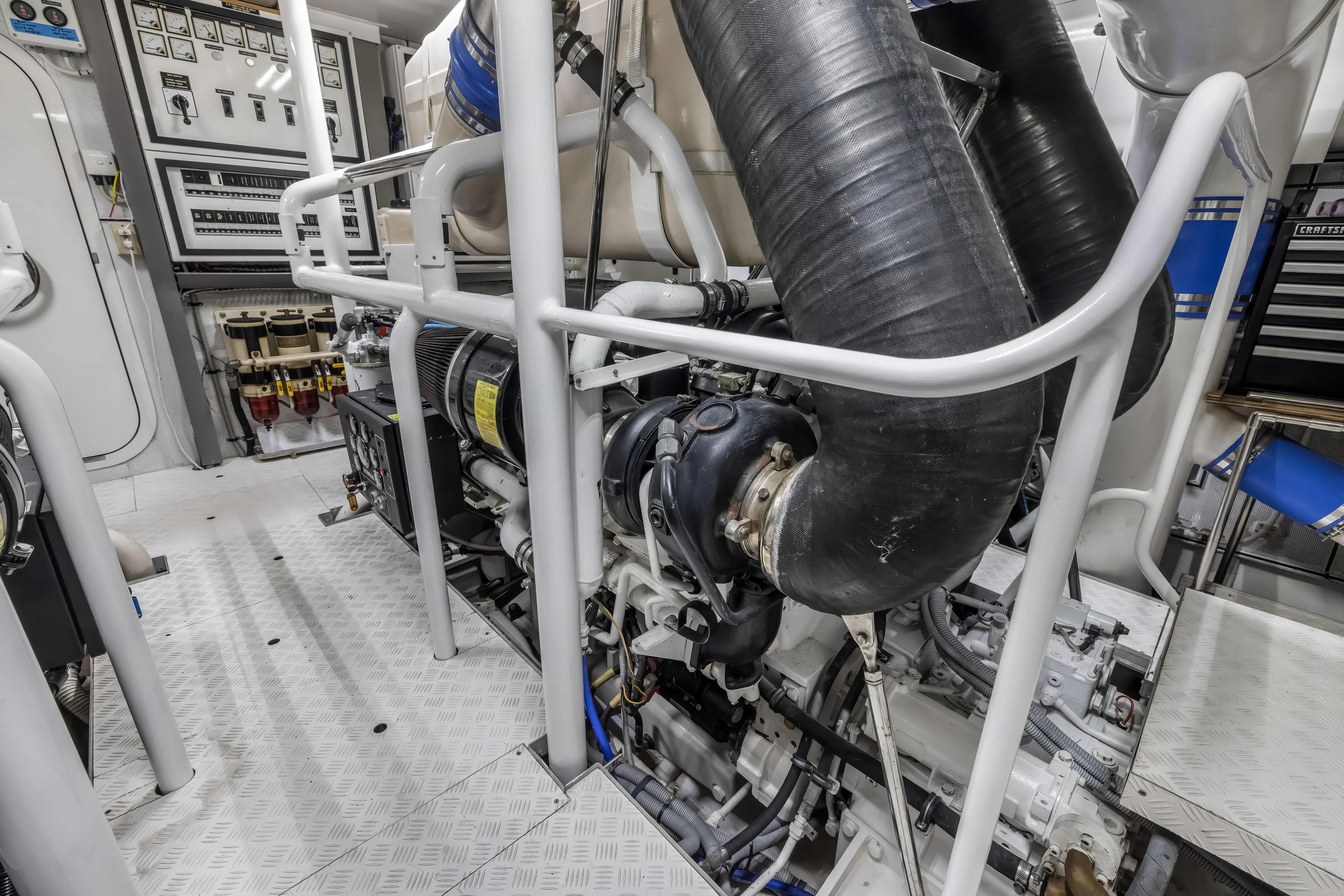 Jus Chill'n Yacht Photos Pics Engine room of 2012 Cheoy Lee 84 Bravo yacht, featuring complex machinery and control panels.