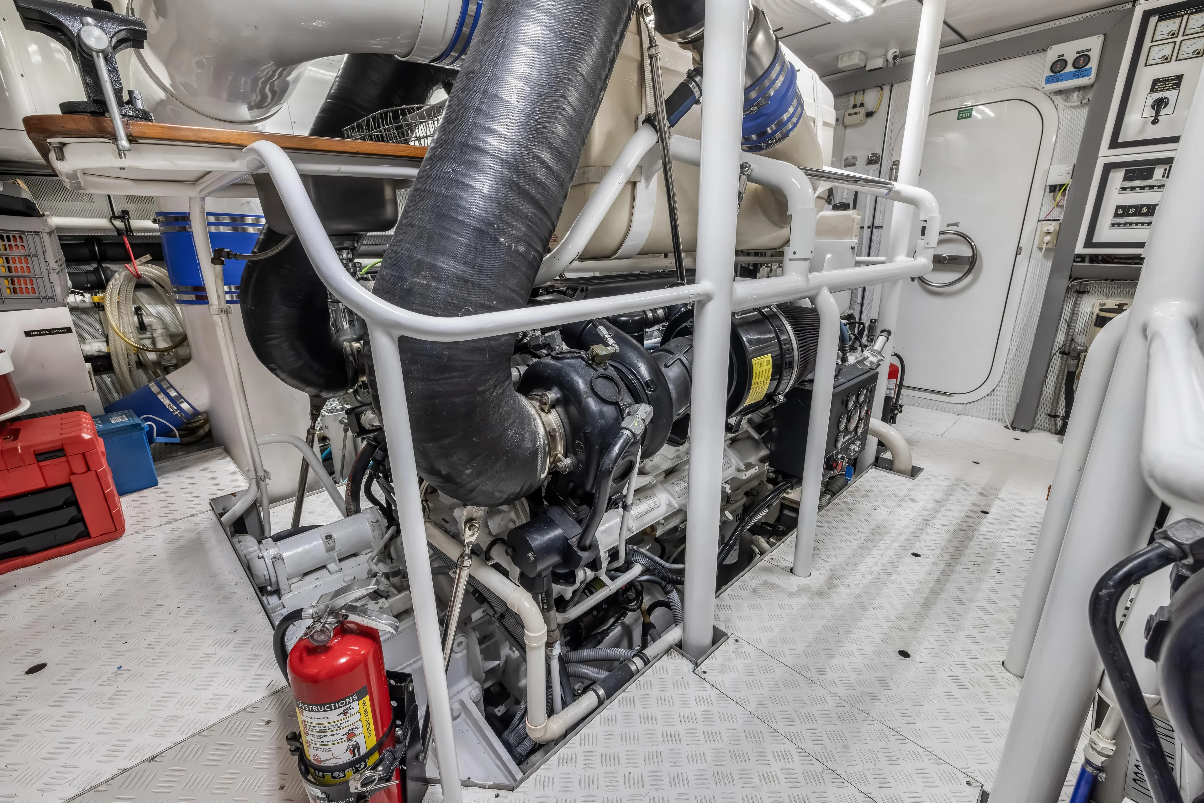 Jus Chill'n Yacht Photos Pics Engine room of 2012 Cheoy Lee 84 Bravo yacht, featuring machinery and safety equipment.