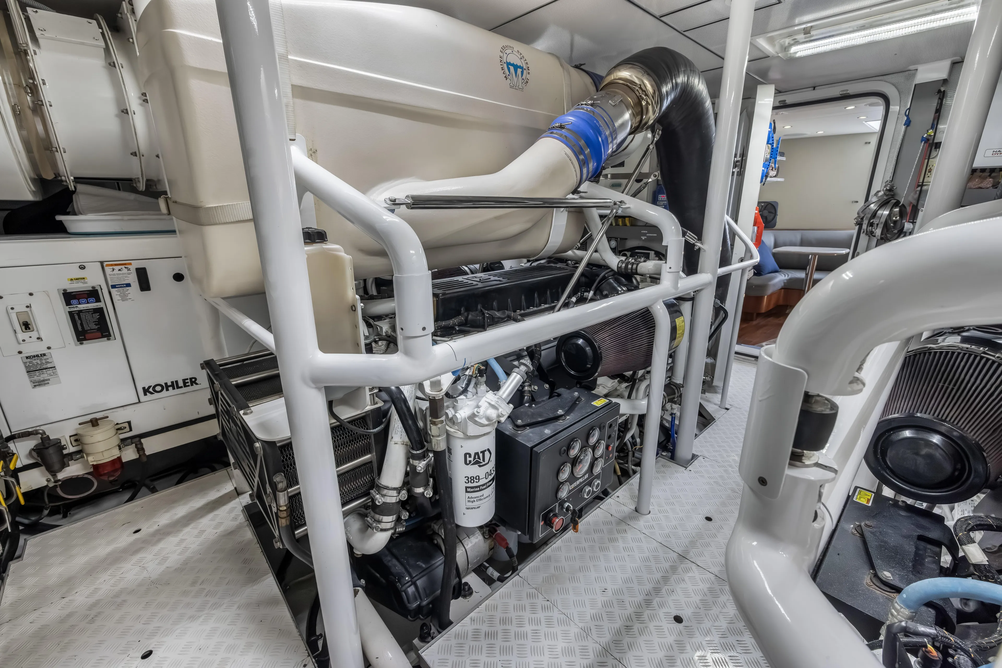 Jus Chill'n Yacht Photos Pics Engine room of 2012 Cheoy Lee 84 Bravo yacht, featuring Kohler generator and CAT machinery.