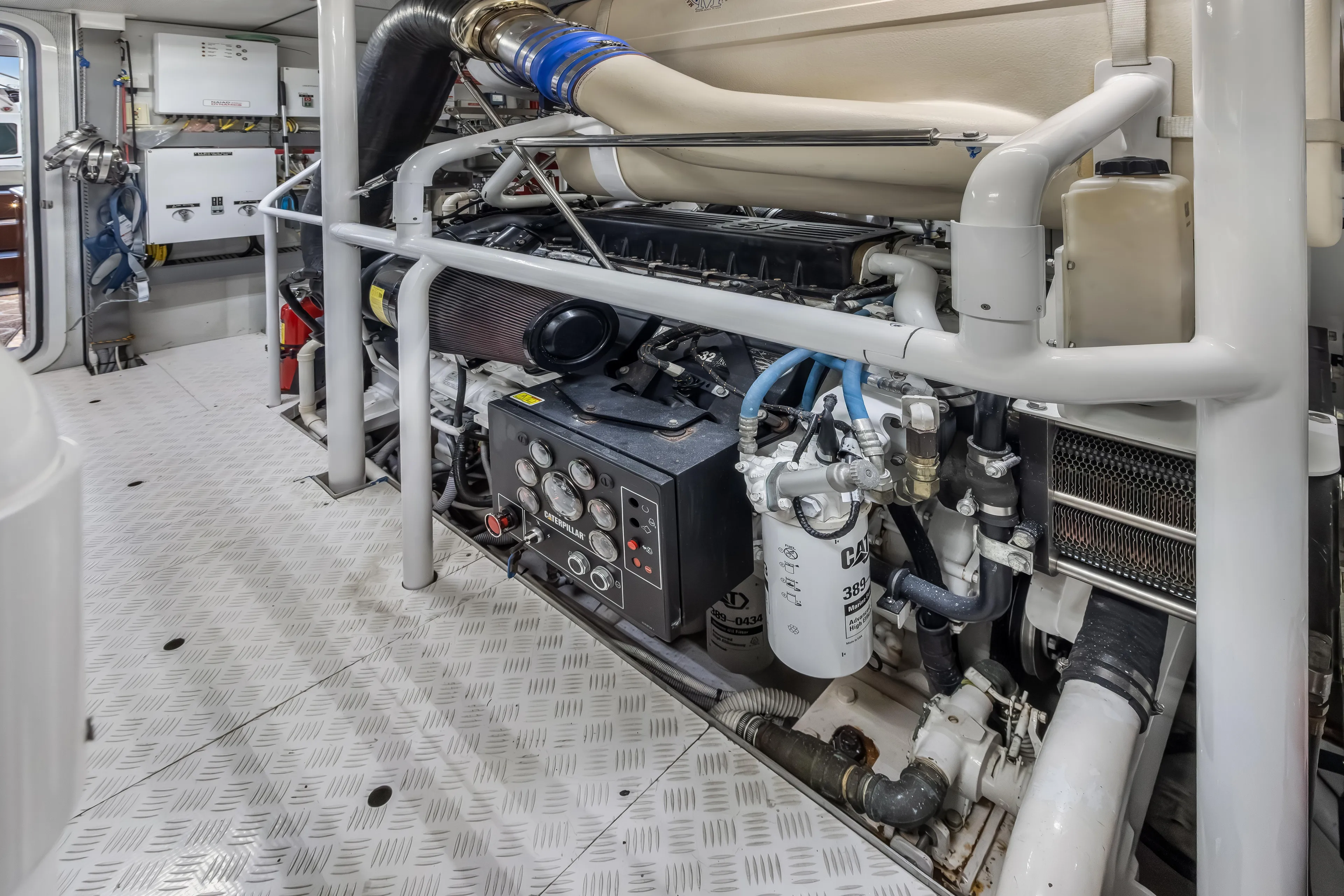 Jus Chill'n Yacht Photos Pics Engine room of 2012 Cheoy Lee 84 Bravo yacht, featuring Caterpillar machinery.