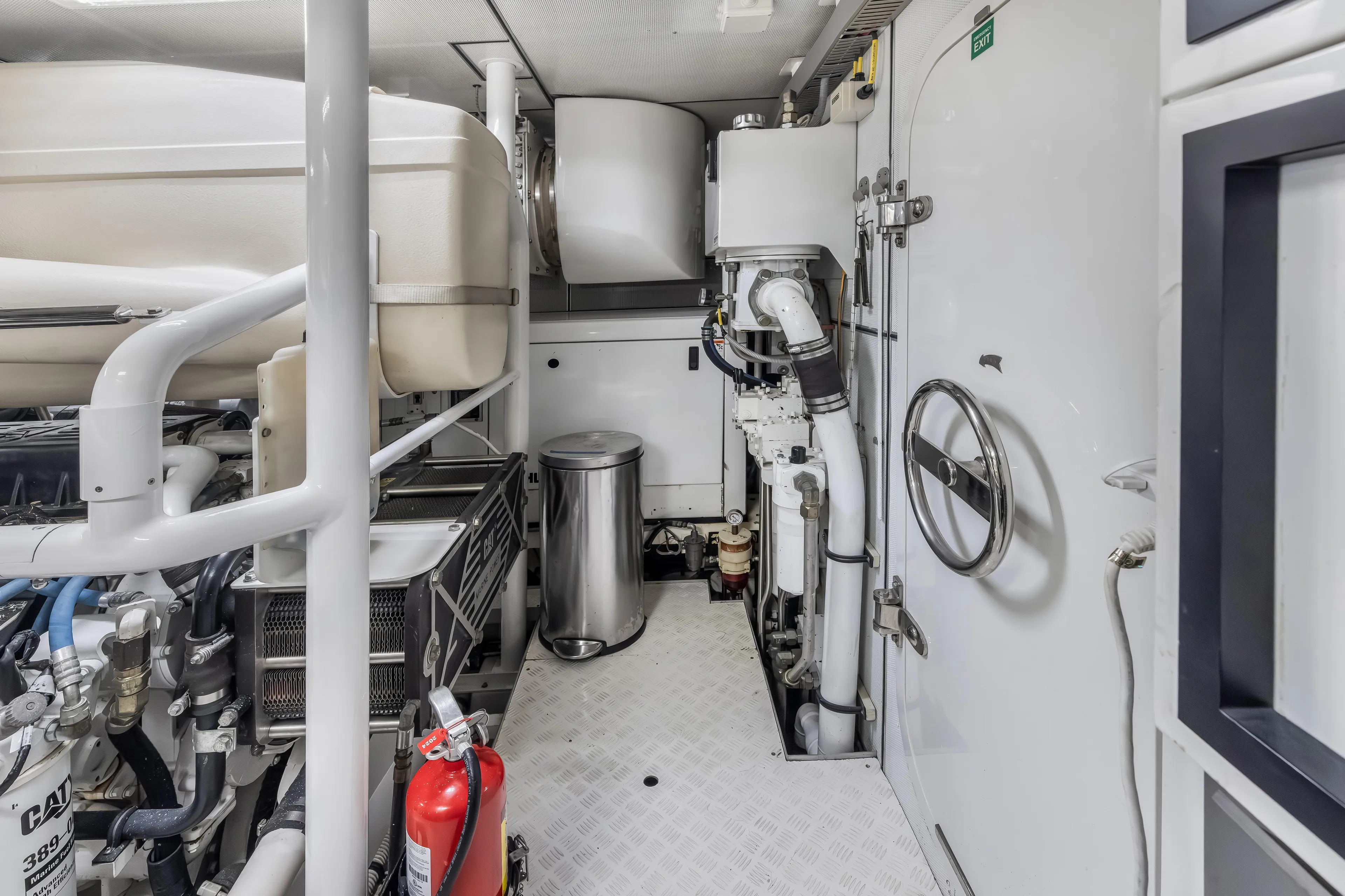 Jus Chill'n Yacht Photos Pics Engine room of 2012 Cheoy Lee 84 Bravo yacht, featuring machinery and safety equipment.