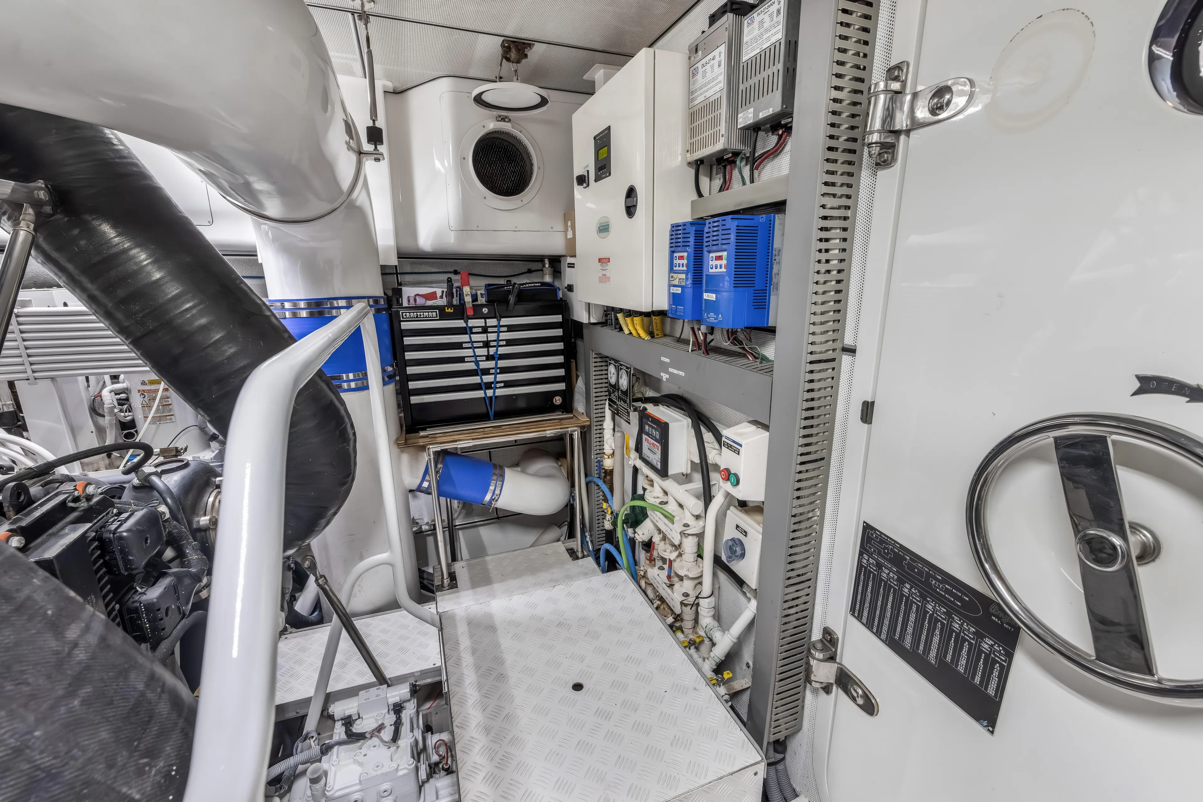 Jus Chill'n Yacht Photos Pics Engine room of 2012 Cheoy Lee 84 Bravo yacht, featuring equipment and control panels.