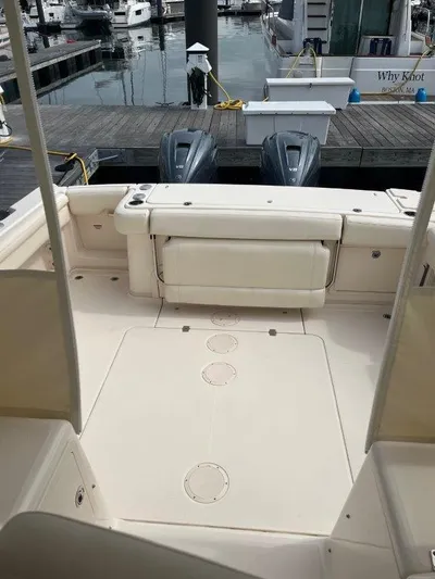  Yacht Photos Pics 2020 Grady-White Express 330 boat interior with dual outboard motors at dock.