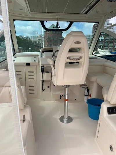  Yacht Photos Pics 2020 Grady-White Express 330 boat interior with helm and seating area.