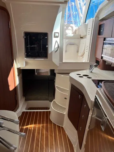  Yacht Photos Pics 2020 Grady-White Express 330 cabin interior with wood flooring and modern amenities.