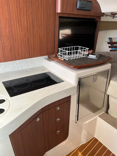  Yacht Photos Pics Interior of 2020 Grady-White Express 330 boat with kitchenette and modern amenities.