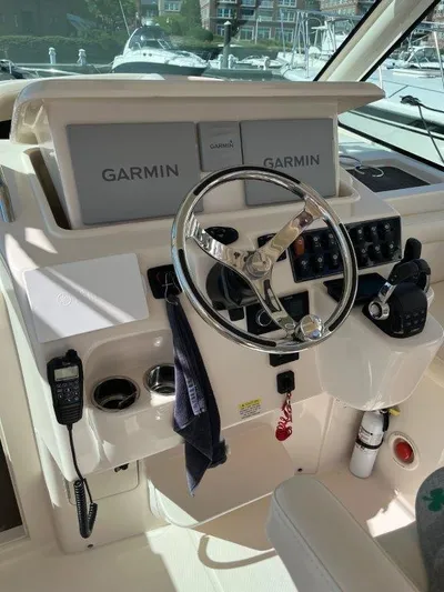  Yacht Photos Pics 2020 Grady-White Express 330 helm with Garmin navigation system and steering wheel.
