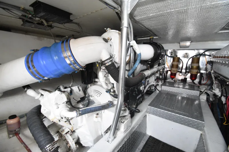 Event Horizon Yacht Photos Pics Engine room of 2000 Ocean Yachts 48 Super Sport, showcasing mechanical components and piping.