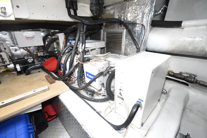 Event Horizon Yacht Photos Pics Engine room of 2000 Ocean Yachts 48 Super Sport with mechanical equipment and wiring.