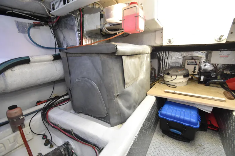 Event Horizon Yacht Photos Pics Engine room of 2000 Ocean Yachts 48 Super Sport with equipment and storage.