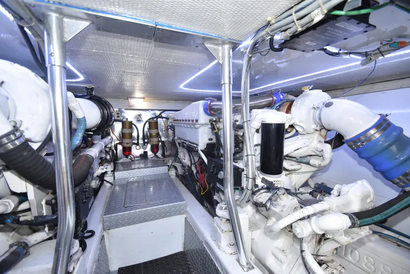 Event Horizon Yacht Photos Pics Engine room of 2000 Ocean Yachts 48 Super Sport, showcasing mechanical components and piping.