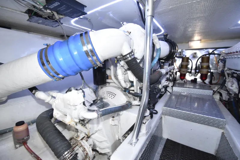 Event Horizon Yacht Photos Pics Engine room of 2000 Ocean Yachts 48 Super Sport, showcasing mechanical components and piping.