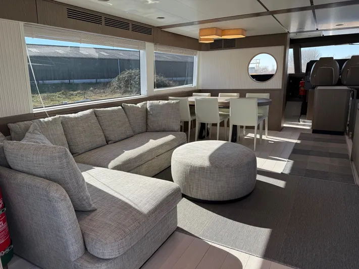  Yacht Photos Pics Luxurious interior of 2023 Azimut Magellano 66 yacht with modern seating and dining area.