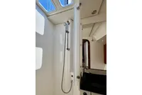 Interior of 2009 Dufour 45E Performance yacht showing modern bathroom with shower and sink.
