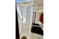 Interior of 2009 Dufour 45E Performance yacht bathroom with shower and sink.