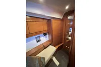 Interior cabin of 2009 Dufour 45E Performance yacht with wooden furnishings.