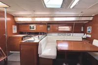 Luxurious interior of 2009 Dufour 45E Performance yacht with kitchen and dining area.