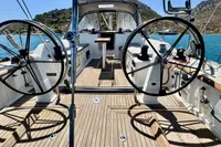 Cockpit of 2009 Dufour 45E Performance yacht with dual steering wheels and teak decking.