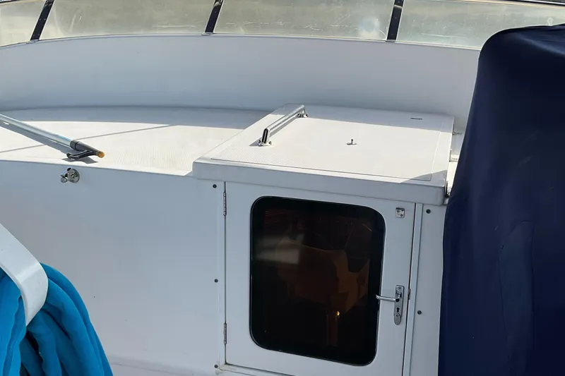 Mariposa Yacht Photos Pics Interior view of 2012 Integrity 45 boat with white cabin and blue seating.