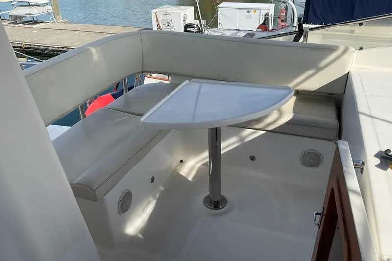 Mariposa Yacht Photos Pics Cozy seating area on 2012 Integrity 45 yacht with a small table.