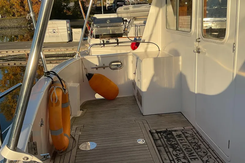 Mariposa Yacht Photos Pics Boat deck of 2012 Integrity 45 with safety equipment and welcome mat.