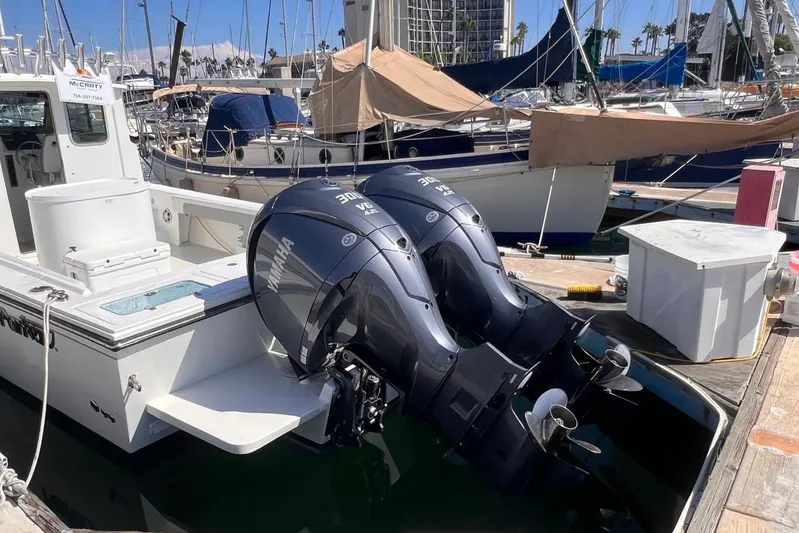 Sd Jam Yacht Photos Pics 2023 Parker 2820 XLD Sport Cabin with dual Yamaha outboard engines docked at marina.
