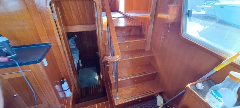 Mariposa Yacht Photos Pics Interior of a 2012 Integrity 45 boat with wooden stairs and cabin access.