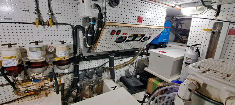 Mariposa Yacht Photos Pics Engine room of a 2012 Integrity 45 boat with control panels and equipment.