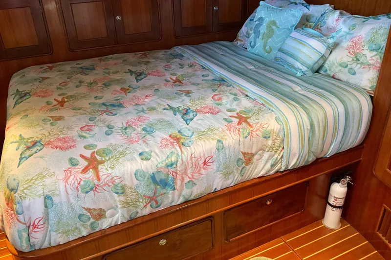 Mariposa Yacht Photos Pics Cozy bedroom in 2012 Integrity 45 boat with ocean-themed bedding.