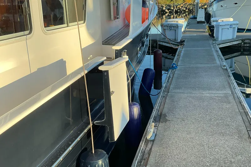 Mariposa Yacht Photos Pics Integrity 45 2012 yacht docked at marina with fenders and dock equipment.