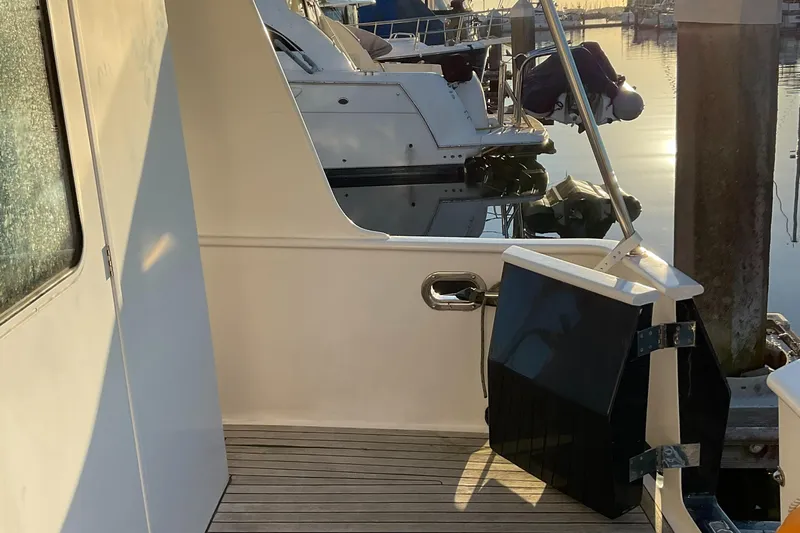 Mariposa Yacht Photos Pics Integrity 45 yacht, 2012 model, docked at marina during sunset.