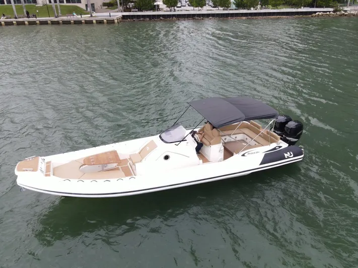 Hoko Yacht Photos Pics 2017 Nuova Jolly Princess boat on water, featuring sleek design and spacious seating.