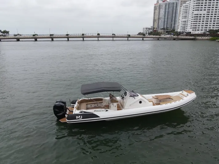 Hoko Yacht Photos Pics 2017 Nuova Jolly Princess boat on water near cityscape and bridge.