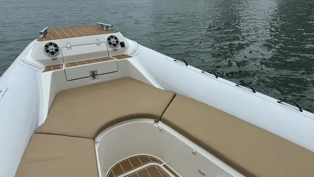 Hoko Yacht Photos Pics 2017 Nuova Jolly Princess boat interior with beige seating and water view.