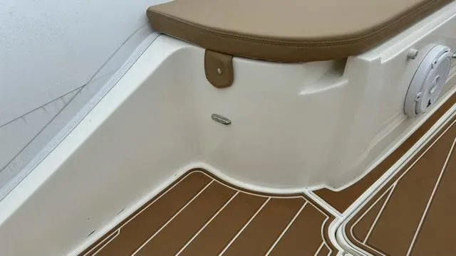 Hoko Yacht Photos Pics 2017 Nuova Jolly Princess boat interior with brown and white seating and flooring.